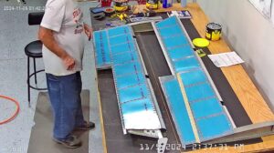 EA: Page 9-15,18. Attach Trim Tab Hinge, Insert Trailing Edge Wedge (Page 9-14)
