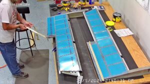 EA: Page 9-15,18. Attach Trim Tab Hinge, Insert Trailing Edge Wedge (Page 9-14)