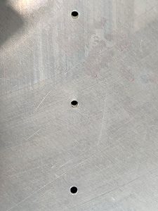 Two misaligned holes between fuselage side skin and SD75F18-4