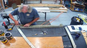 Attaching the rear wing attach brackets to the top channel with the AN3-6 bolts.