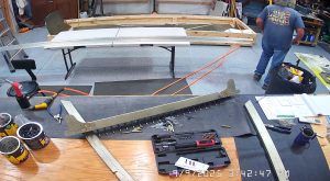 Attaching the rear wing attach brackets to the top channel with the AN3-6 bolts.