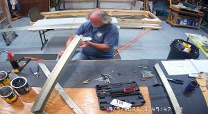 Attaching the rear wing attach brackets to the top channel with the AN3-6 bolts.