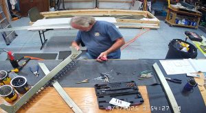 Attaching the rear wing attach brackets to the top channel with the AN3-6 bolts.