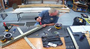 Attaching the rear wing attach brackets to the top channel with the AN3-6 bolts.