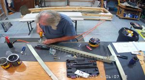 Attaching the rear wing attach brackets to the top channel with the AN3-6 bolts.