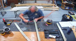 Attaching the rear wing attach brackets to the top channel with the AN3-6 bolts.