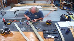 Attaching the rear wing attach brackets to the top channel with the AN3-6 bolts.
