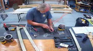 Attaching the rear wing attach brackets to the top channel with the AN3-6 bolts.