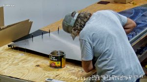 Riveting the forward bottom fuselage skin and gussets
