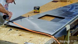 Riveting the forward bottom fuselage skin and gussets