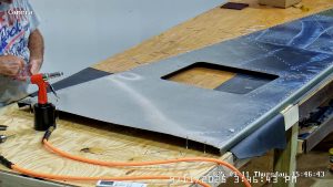 Riveting the forward bottom fuselage skin and gussets