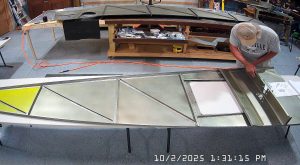 Test fitting the jump seat front and rear channels on the fuselage floor, and the back panel