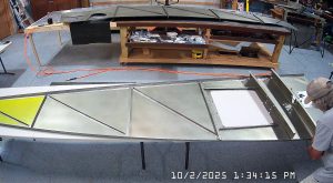 Test fitting the jump seat front and rear channels on the fuselage floor, and the back panel