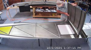 Test fitting the jump seat front and rear channels on the fuselage floor, and the back panel