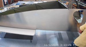 Riveting the side channels of the 750 SD baggage back to the side skins.