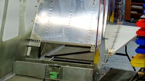 Building the Zenith 750 SD fuselage FR-04. Riveting the jump seat channels and linear actuator mount bracket