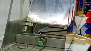 Building the Zenith 750 SD fuselage FR-04. Riveting the jump seat channels and linear actuator mount bracket