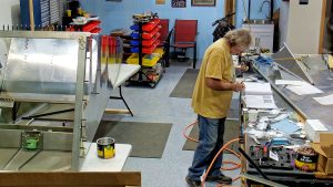 Riveting the side channels of the 750 SD baggage back to the side skins.