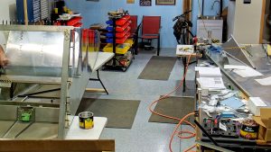 Riveting the side channels of the 750 SD baggage back to the side skins.