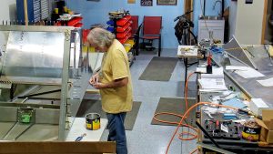 Riveting the side channels of the 750 SD baggage back to the side skins.