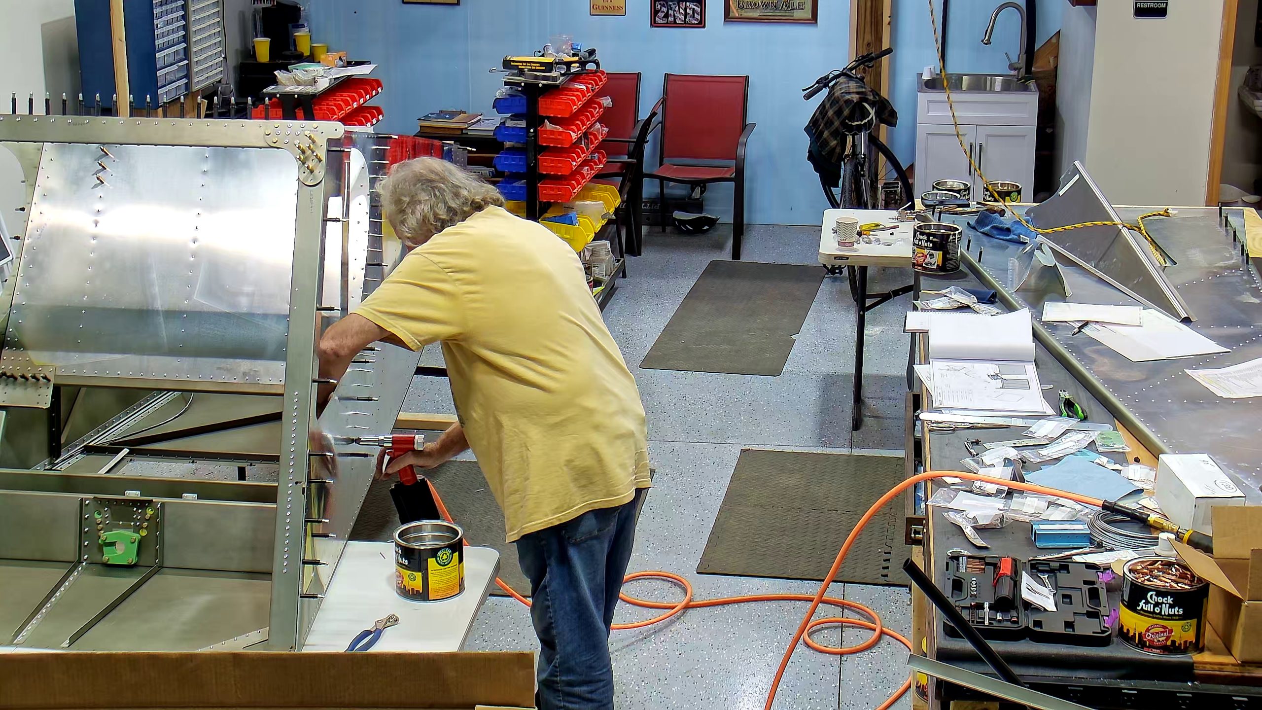 Riveting the side channels of the 750 SD baggage back to the side skins.