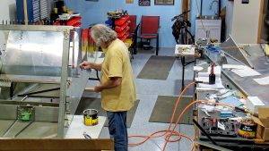 Riveting the side channels of the 750 SD baggage back to the side skins.