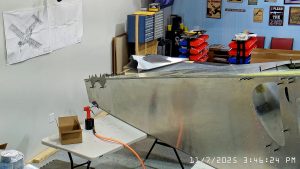 Installing A4 rivets to hold side skins to 750 SD top skin longerons