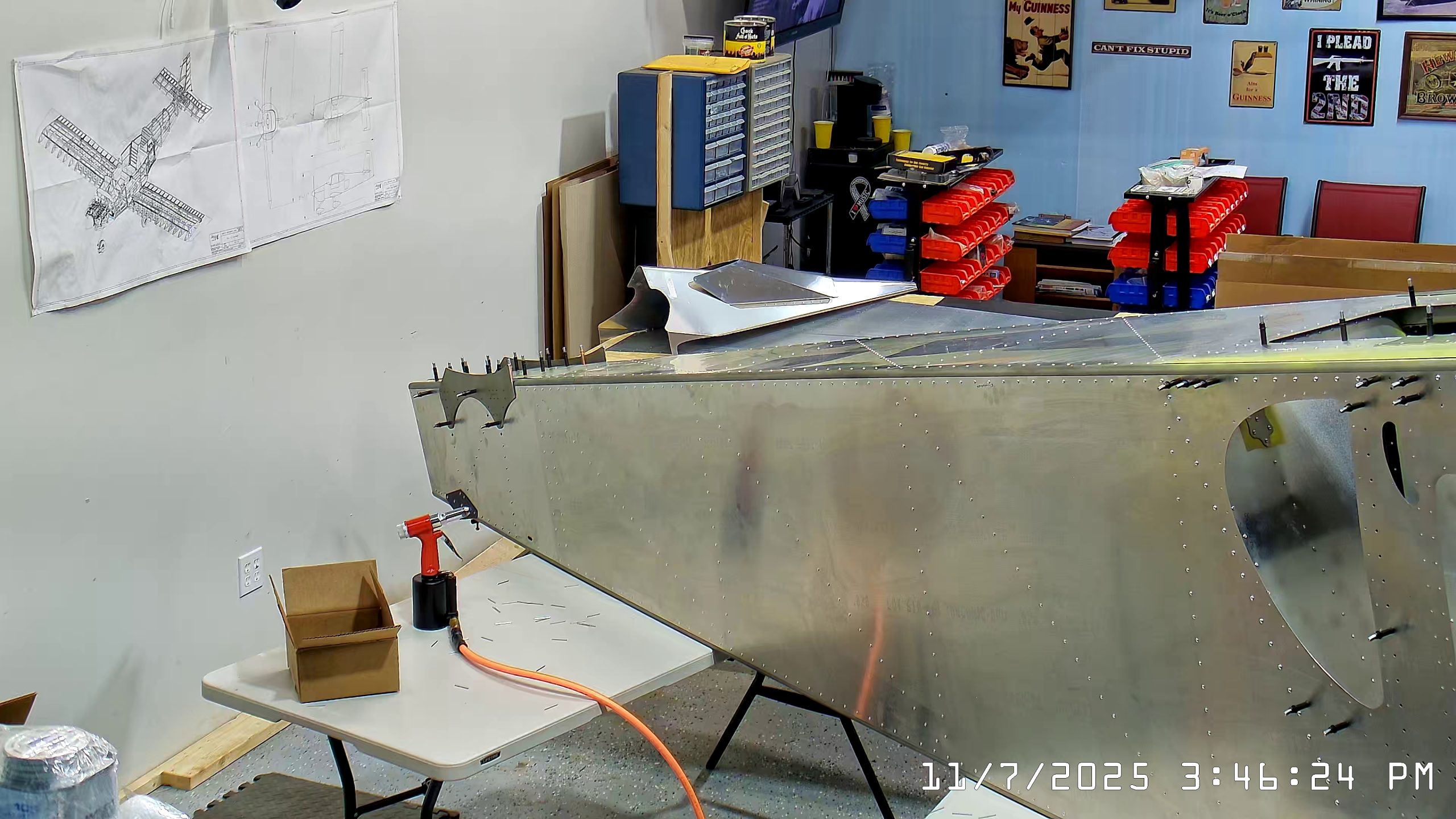 Installing A4 rivets to hold side skins to 750 SD top skin longerons