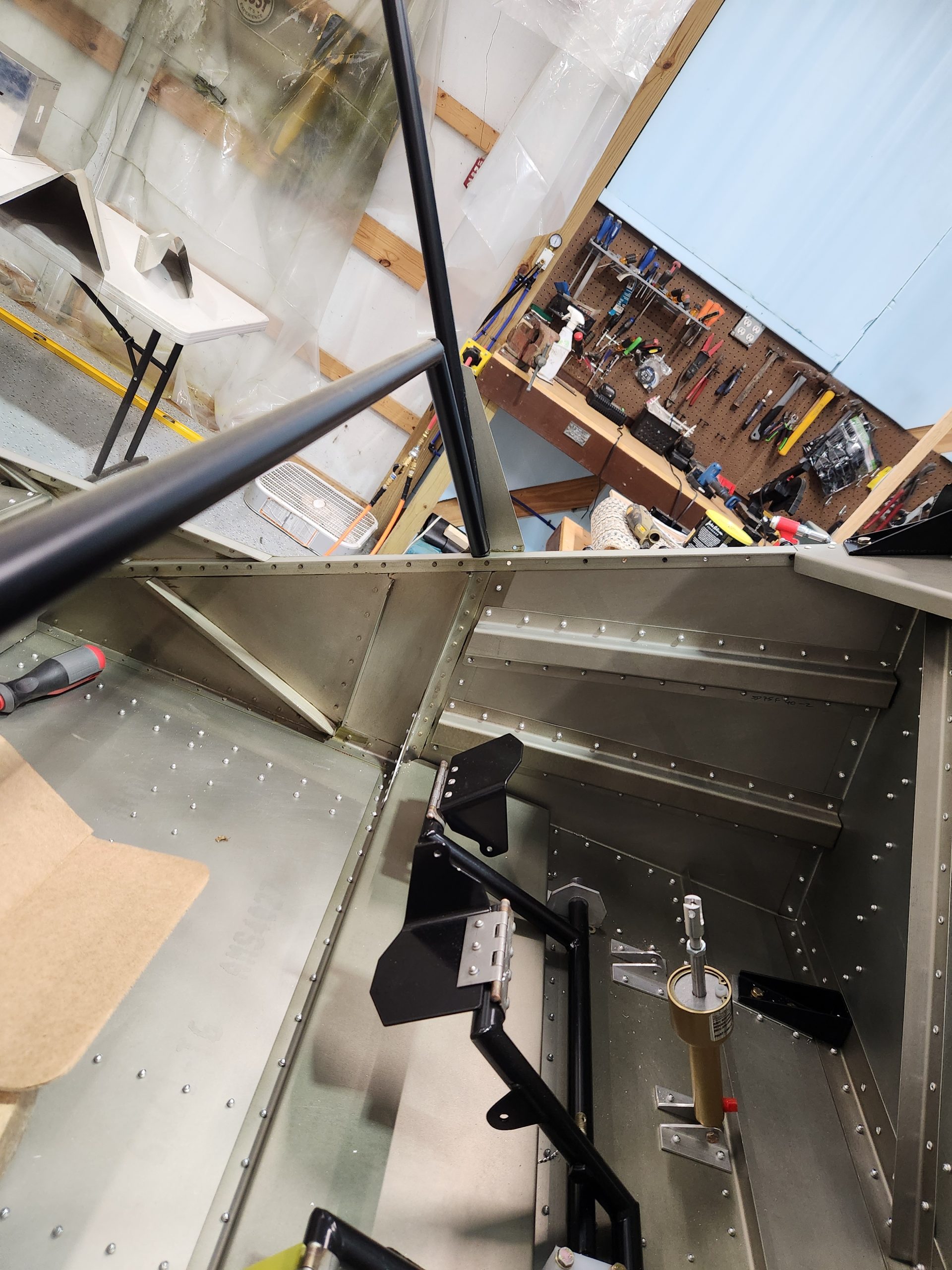 Inside view of cabin with lower left engine mount and brake master cylinder in place